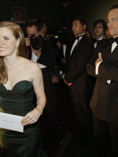 Amy Adams prepares to take the Oscar stage as Tom Hanks looks on