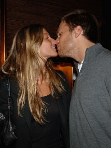 Gisele Bundchen and Tom Brady steal a kiss at the Ermenegildo Zegna event in NY