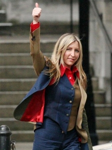 Heather Mills gives the thumbs up, as she leaves the Royal Courts of Justice 