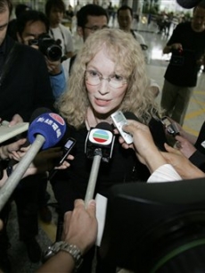 Mia Farrow speaks to the press as she arrives in Hong Kong, May 1, 2008 