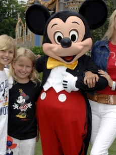 Christie Brinkley, son Jack, & daughter Sailor with Mickey in Disneyland