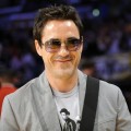 A happy Robert Downey Jr. is seen at halftime during Game 5 of the NBA basketball finals 