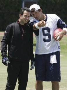 Helio Castroneves and Cowboys quarterback Tony Romo at a practice session