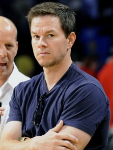 A scowling Mark Wahlberg is seen at halftime during Game 5 of the NBA basketball finals 