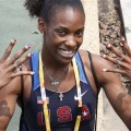 U.S. women’s 400-meter runner Dee Dee Trotter shows off her U.S. team colored nails during her morning practice, August 4, 2008 