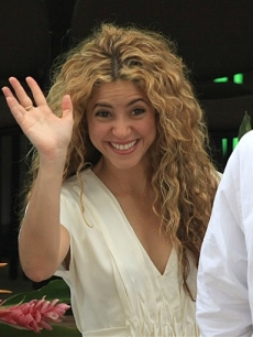 Shakira waves to fans at the Independence Day parade in Leticia, Columbia