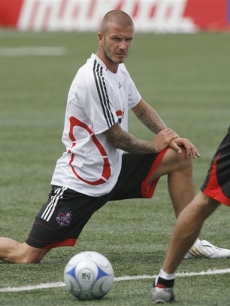 David Beckham stretches before the All-Star soccer game, Toronto 