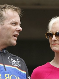 Just another day at the race track for Kiefer Sutherland and Cindy McCain, chatting before the NASCAR Sprint Cup Series Pennyslvania 500 auto race