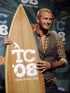 David Beckham poses with his surfboard for Choice Male Athlete