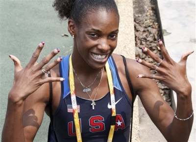 U.S. women’s 400-meter runner Dee Dee Trotter shows off her U.S. team colored nails during her morning practice, August 4, 2008 