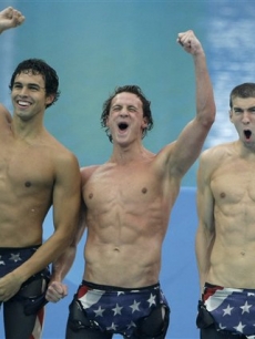 Ricky Berens, Ryan Lochte and Michael Phelps celebrate winning the gold medal in Beijing, Wednesday, Aug. 13, 2008