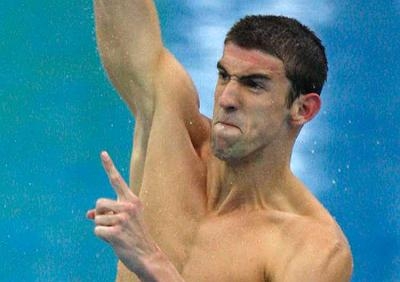 Michael Phelps celebrates his eighth gold