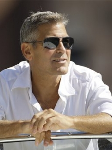 George Clooney arrives in Venice, Italy on a taxi boat for the 65th Venice Film Festival