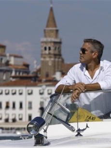 George Clooney arrives in Venice, Italy on a taxi boat for the 65th Venice Film Festival
