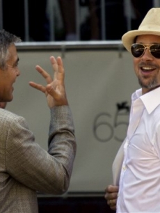 George Clooney shares a joke with Brad Pitt at the 65th edition of the Venice Film Festival 