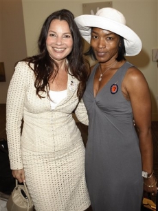 Actresses Fran Drescher, left, and Angela Bassett pose together during the Capitol File Magazine/Viacom luncheon honoring Marian Wright Edelman in Denver, Wednesday, Aug. 27, 2008 