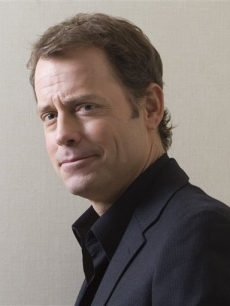 Greg Kinnear poses for a photo following a interview at the Toronto Film Festival