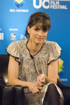 Amanda Peet listens to a question at the news conference for the film ‘What doesn’t kill you’ at the Toronto Film Festival