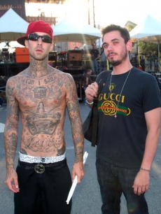 Travis Barker and DJ AM of TRVSDJAM perform during the celebration of the launch of T-Mobile in South Carolina at T-Mobile Boulevard