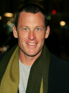 Champion cyclist Lance Armstrong smiles for the cameras at the ‘We Are Marshall’ premiere 