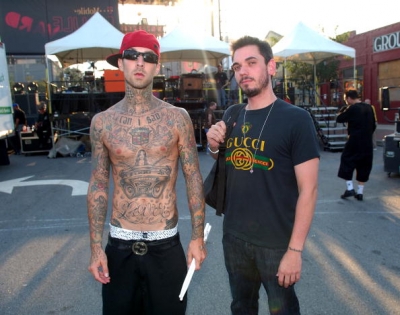 Travis Barker and DJ AM of TRVSDJAM perform during the celebration of the launch of T-Mobile in South Carolina at T-Mobile Boulevard
