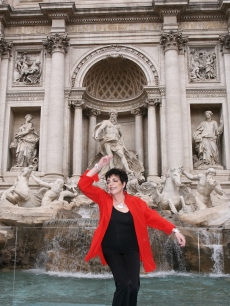 Liza Minnelli throws a coin into the Trevi Fountain as she presents her Live Tour 