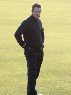 Hugh Grant looks for his ball at the Alfred Dunhill Links Championship in Scotland