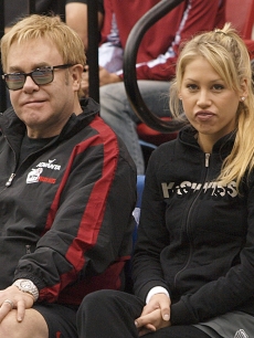 Sir Elton John and Anna Kournikova attend a Advanta WTT Smash Hits event 
