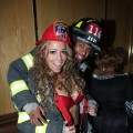 Mariah Carey and Nick Cannon as firefighters at a Halloween party at Marquee