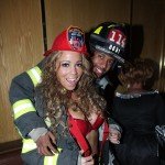 Mariah Carey and Nick Cannon as firefighters at a Halloween party at Marquee