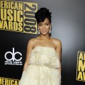 Rihanna is all wrapped in her in yellow dress at the 2008 AMAs