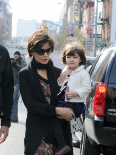 Katie Holmes walks with her daugther Suri in midtown Manhattan