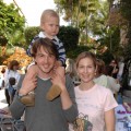Daniel Giersch, Kelly Rutherford and their son Hermes pose during The Easter Beagle Presents Canine Couture at Palm Beach Fashion Week