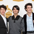 Nick Jonas, Joe Jonas, and Kevin Jonas of The Jonas Brothers pose in the press room during the Grammy Nominations concert
