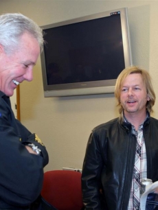 David Spade chats with a Phoenix police officer