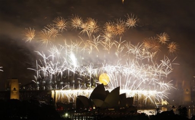 Fireworks explode over the Sydney Harbour Bridge and the Opera House during the New Year’s celebrations on Sydney Harbour in Sydney, Australia