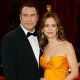 John Travolta and wife Kelly Preston arrive at the Academy Awards in February 2008