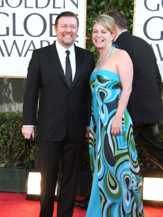 Ricky Gervais and partner Jane Fallon show their pearly whites on the Golden Globes red carpet