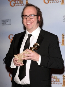 Paul Giamatti proudly shows off his Golden Globe for Best Actor in a TV Miniseries for ‘John Adams’