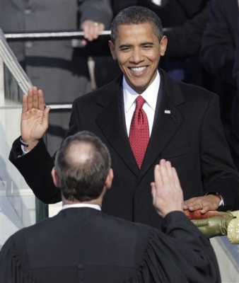 Barack Obama takes the oath of office from Chief Justice John Roberts to become the 44th president of the United States