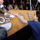 Angelina Jolie signs an autograph on her way into the SAG Awards