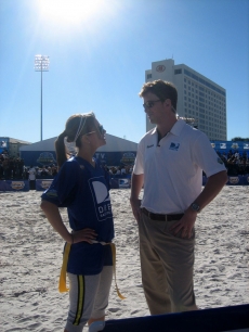 Maria crosses into enemy territory to chat with the other team’s coach - Eli Manning