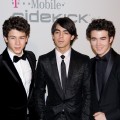 The Jonas Brothers hit the red carpet at the Clive Davis pre-Grammy bash