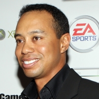 Tiger Woods poses at the Tiger Woods Video Game launch party