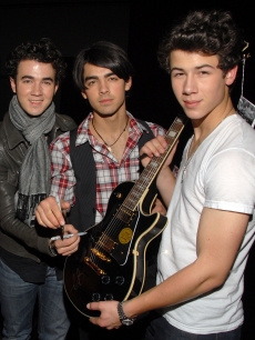 Kevin Jonas, Joe Jonas, and Nick Jonas of The Jonas Brothers attend 51st Annual GRAMMY Awards MusiCares Signings Day 1 at the Staples Center