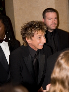 Barry Manilow makes an entrance at the Clive Davis pre-Grammy party