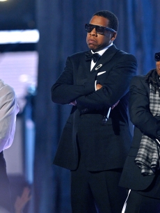 Rappers T.I., Jay-Z, and Lil Wayne perform