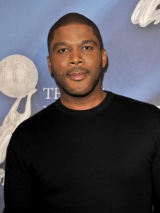 Tyler Perry smiles on the NAACP red carpet