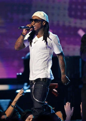 Li’l Wayne performs onstage during the 51st Annual Grammy Awards rocking a white hat