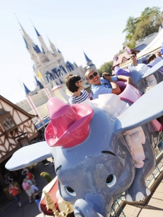 Katie Holmes and Connor Cruise on Dumbo at Disney World